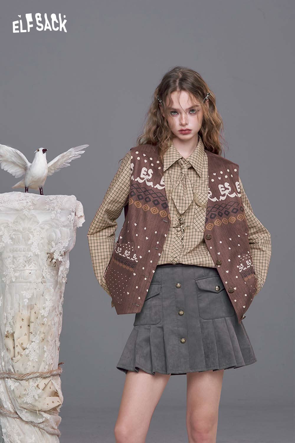 ELFSACK plaid lace accent long sleeve shirt paired with a stylish brown vest and gray skirt