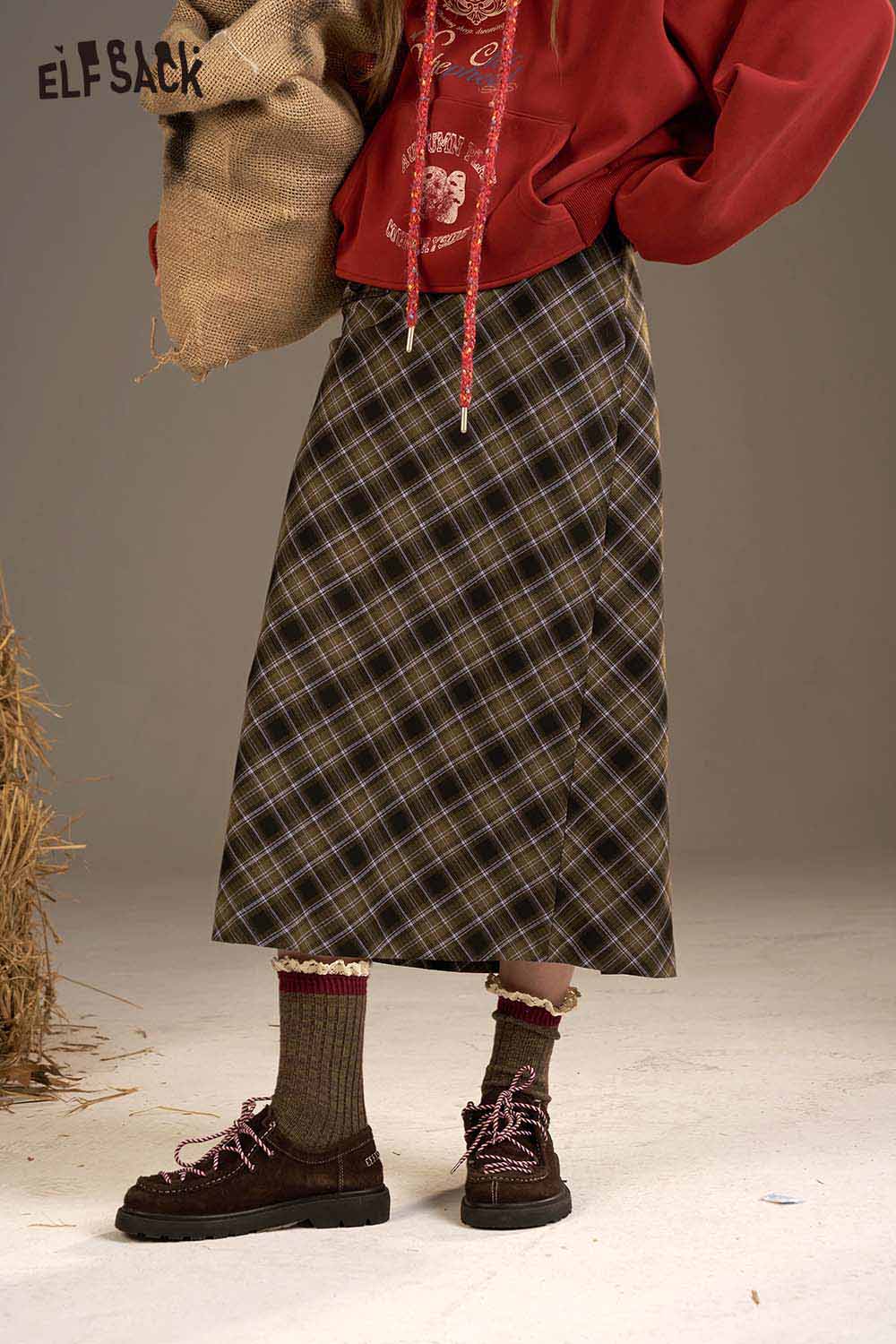 ELFSACK plaid straight long skirt styled with a cozy red hoodie and brown shoes for a casual look