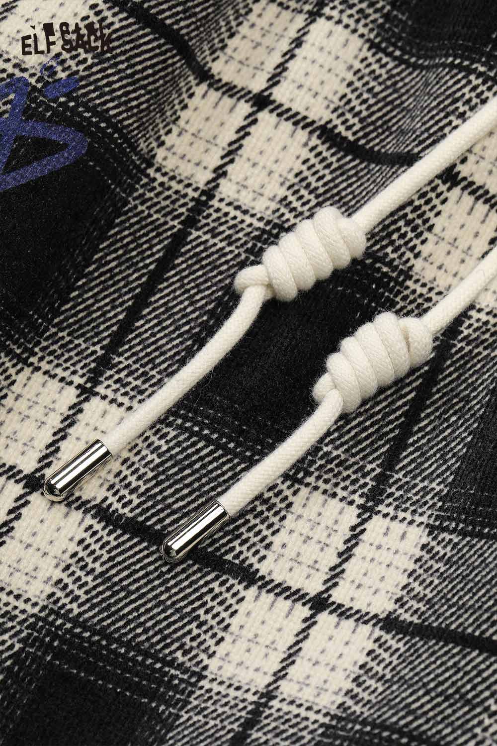Close-up of ELFSACK plaid wide leg pants for women with drawstring detail in black and white pattern