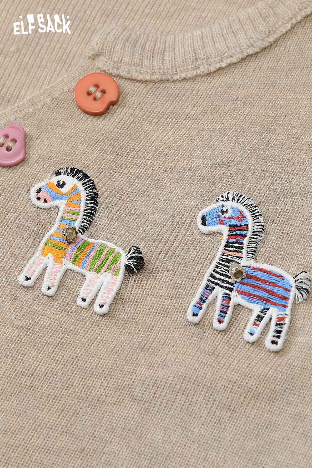 ELFSACK playful animal motif cardigan featuring colorful zebra embroidery on a beige background