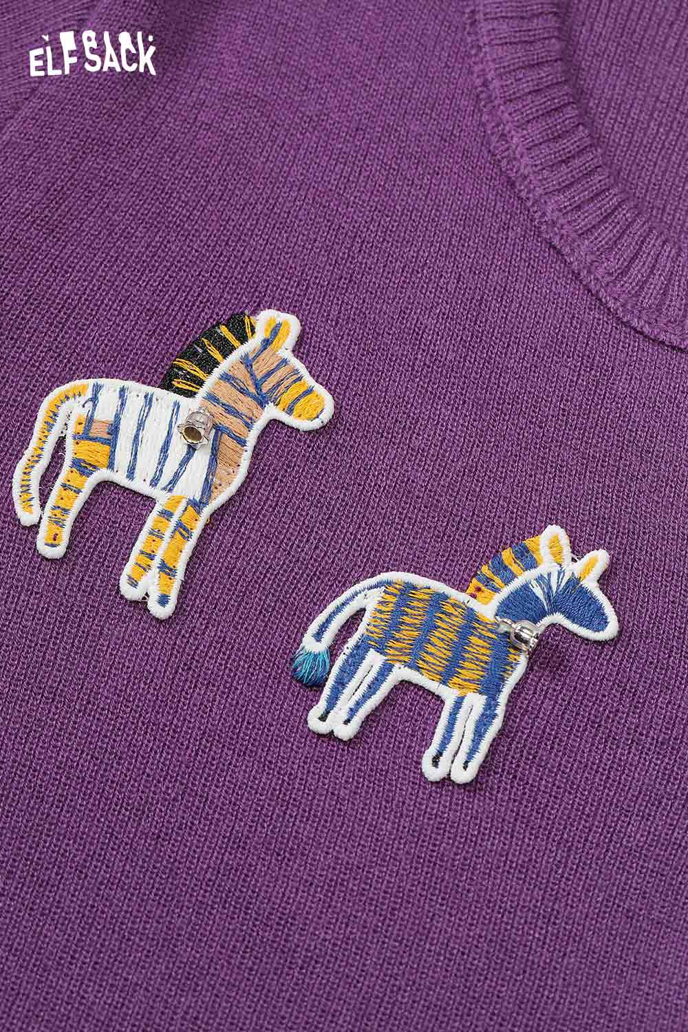 ELFSACK playful animal motif cardigan featuring colorful zebra patches on a purple knitwear
