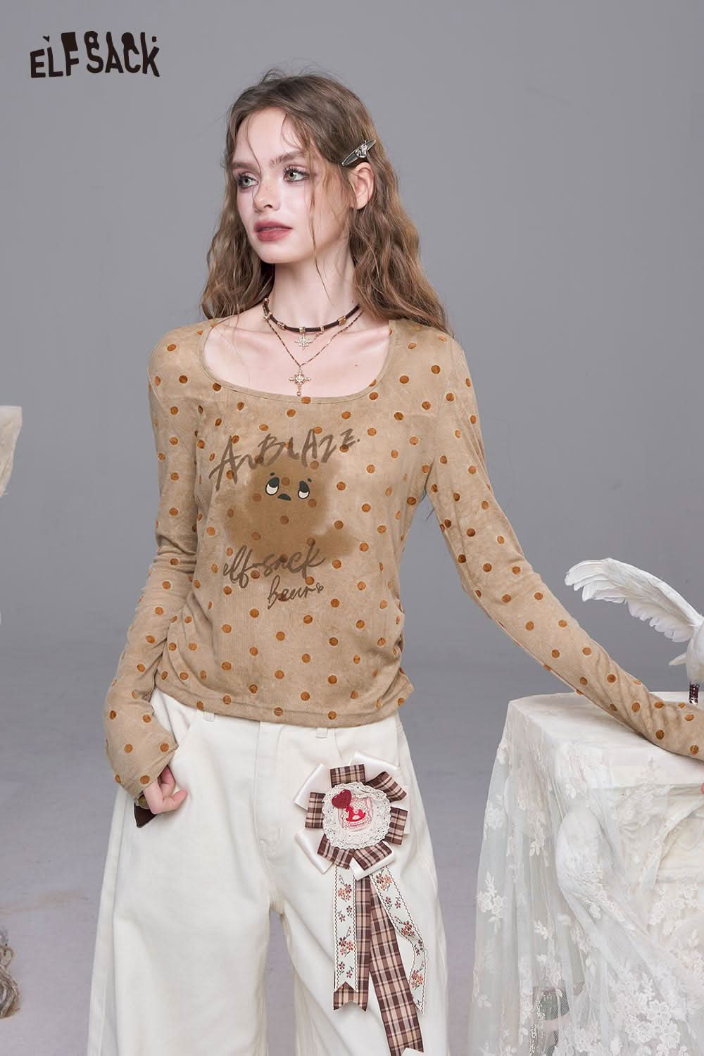Stylish ELFSACK playful graphic print tee for women with a polka dot design and relaxed fit