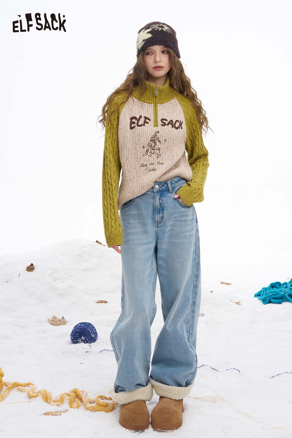 Women wearing ELFSACK plush cuff straight jeans for women with a cozy sweater in a snowy setting