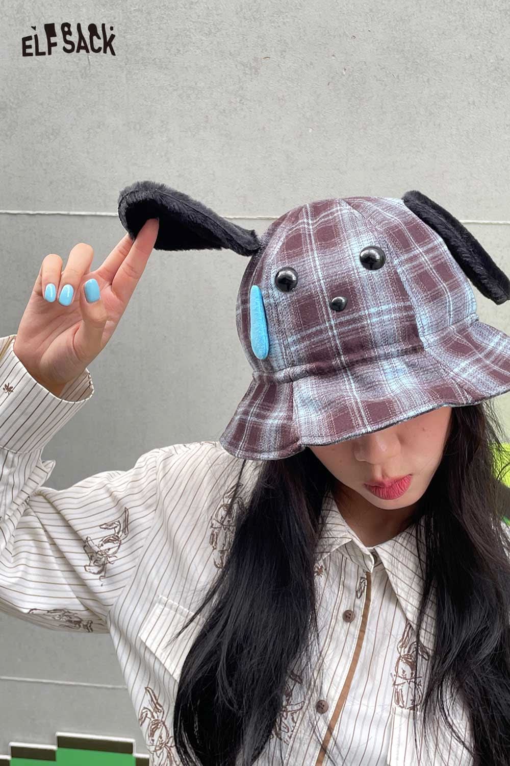 Woman wearing a plush ear tartan bucket hat with playful dog ears and buttons for a fun, stylish look