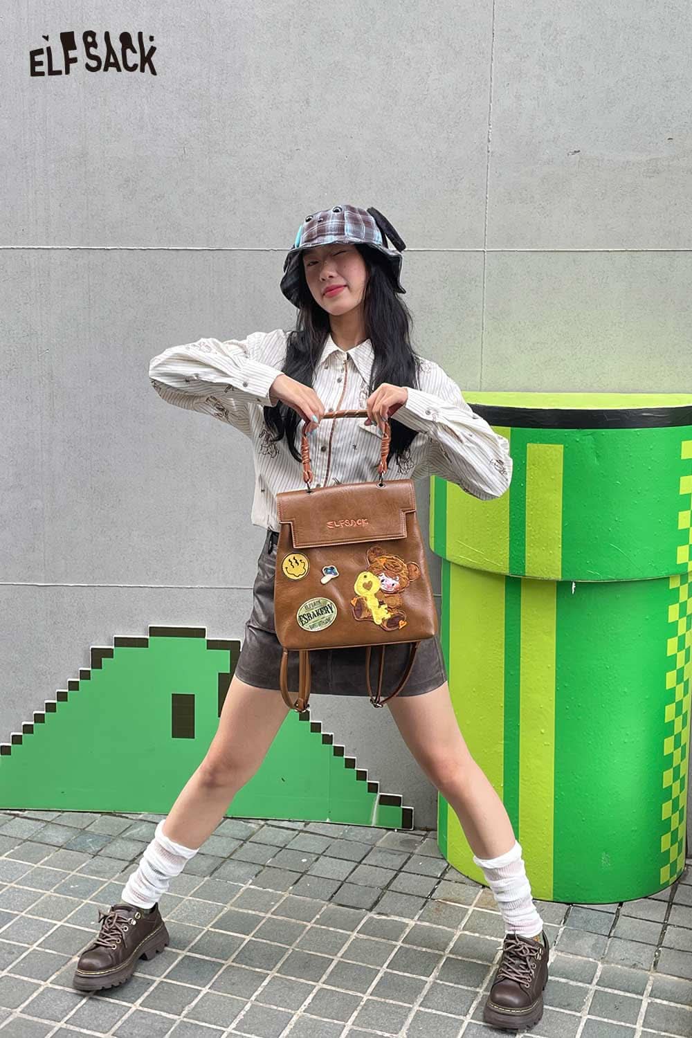 ELFSACK plush ear tartan bucket hat styled with a casual outfit for a trendy look