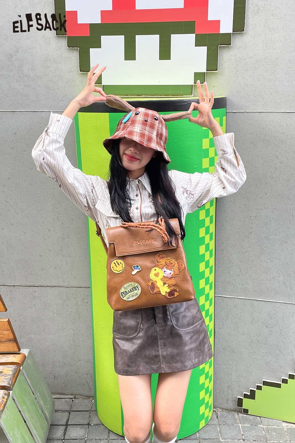 ELFSACK plush ear tartan bucket hat styled with a plaid pattern for a trendy look