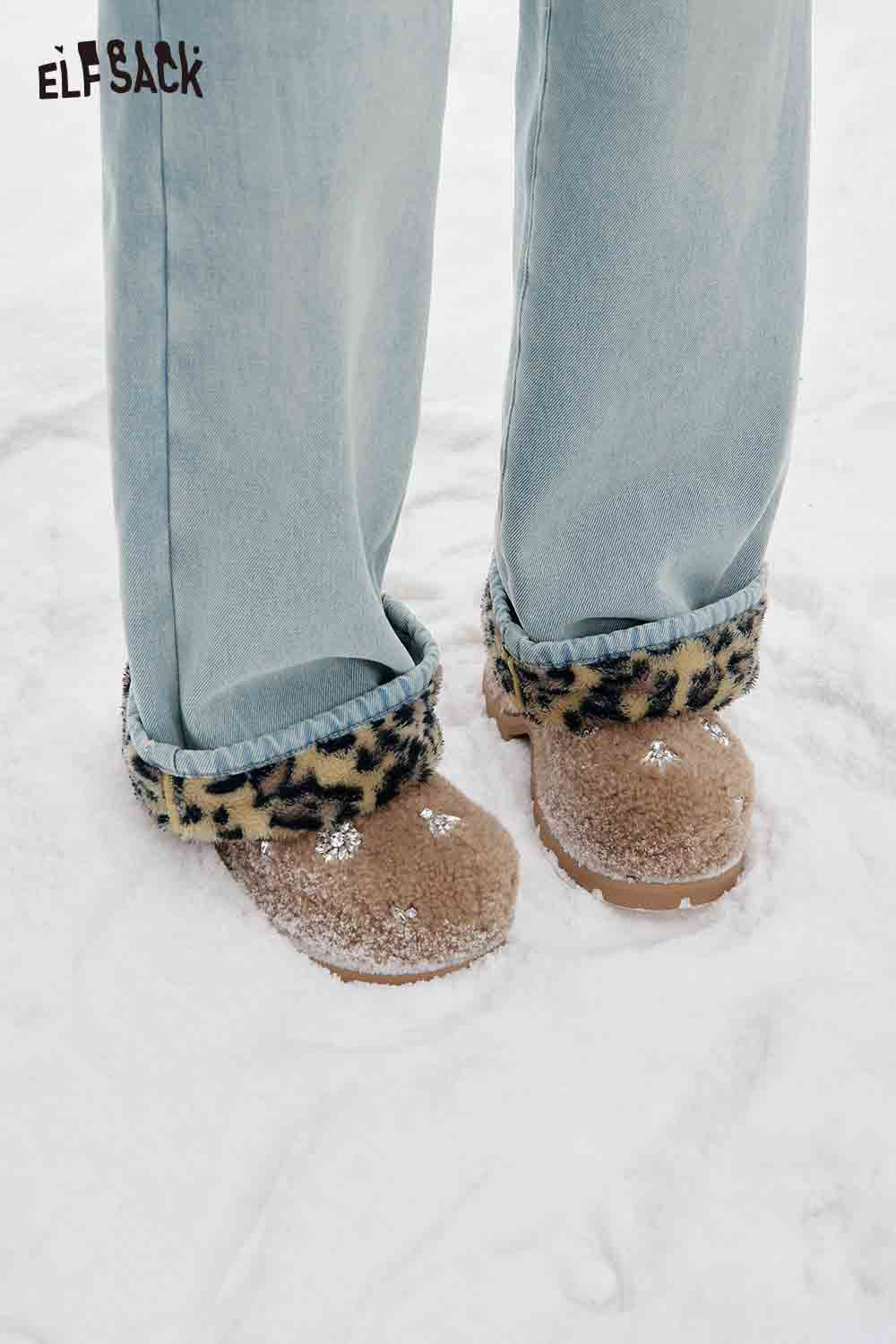 ELFSACK plush leopard lining floor length pants paired with cozy slippers in a snowy setting