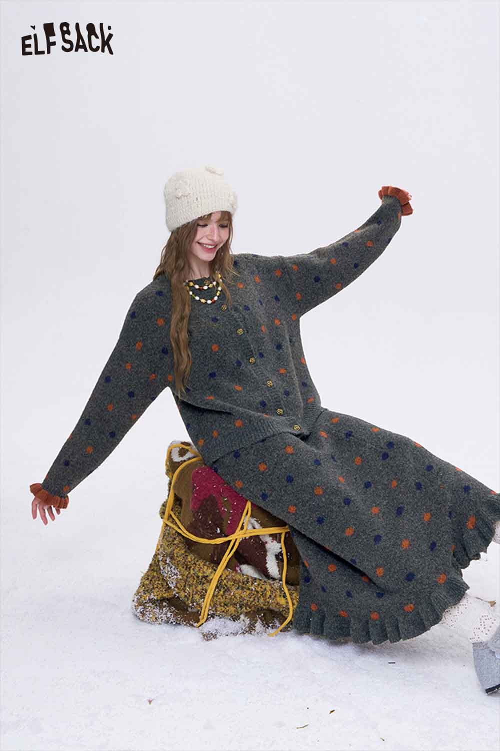 Woman in a cozy ELFSACK polka dot skirt set for women, featuring colorful dots and a playful design