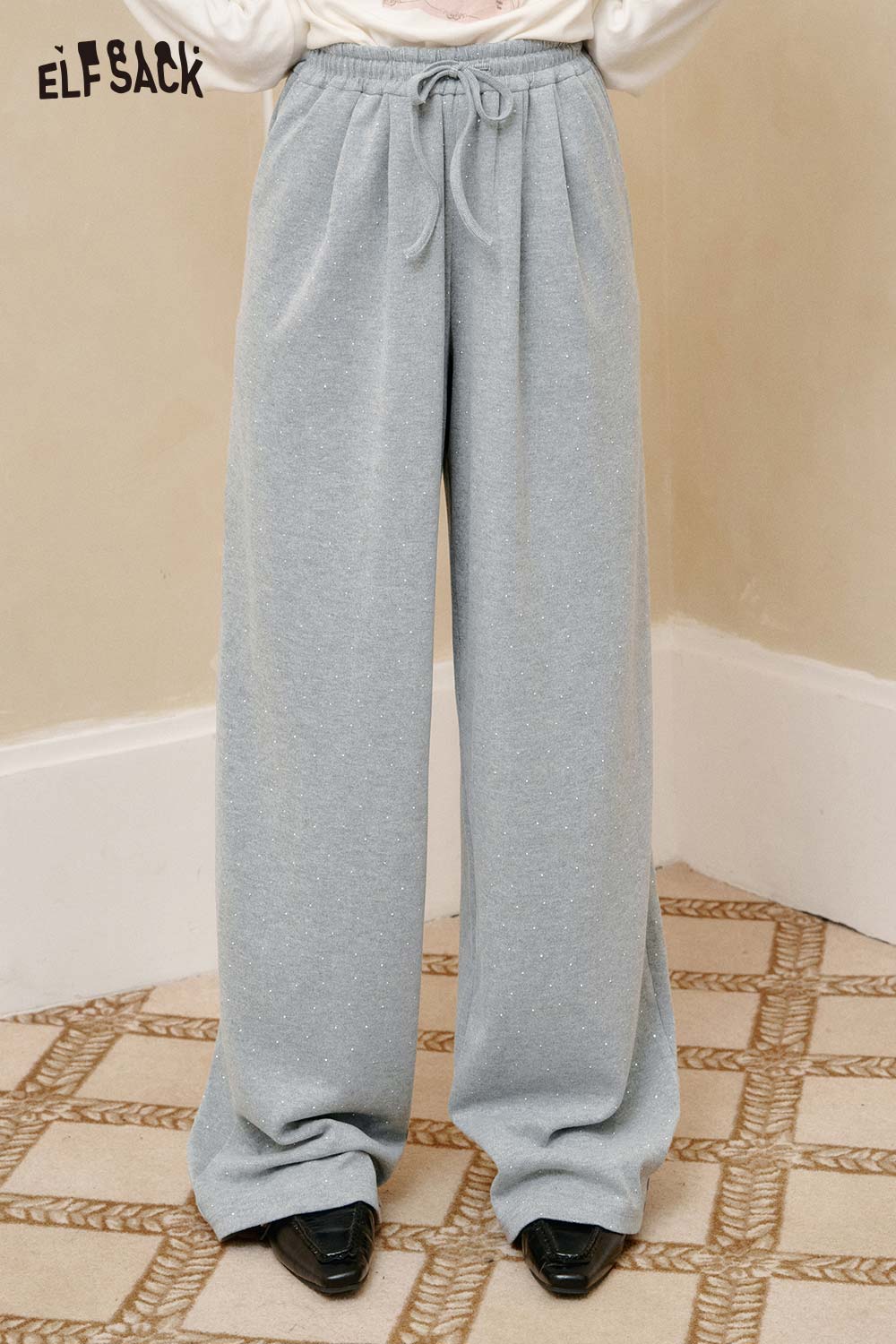 Light gray polyester crinkle sweatpants for women with a relaxed fit and drawstring waist