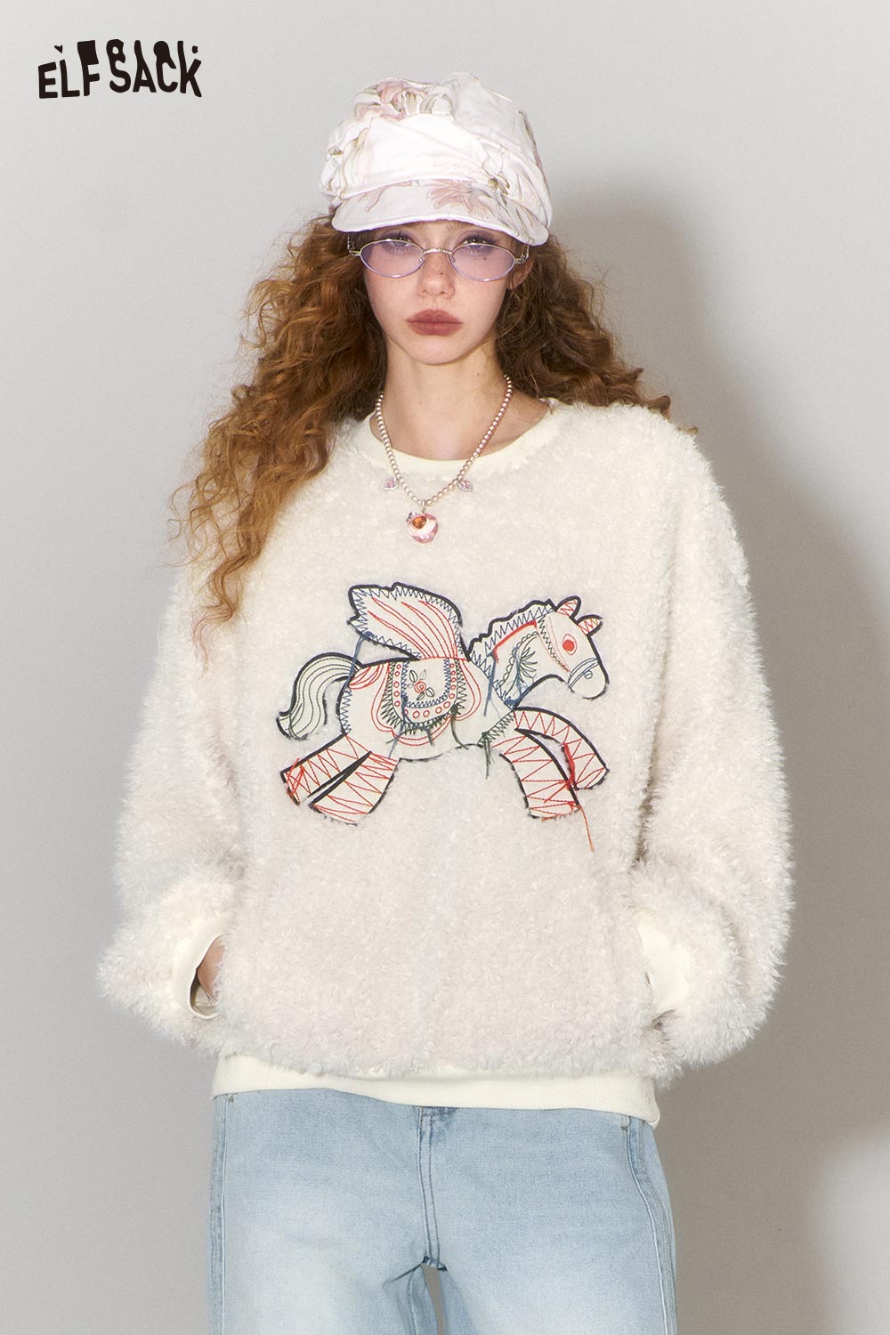 ELFSACK pony embroidered plush sweatshirt in soft white with playful horse design for cozy style