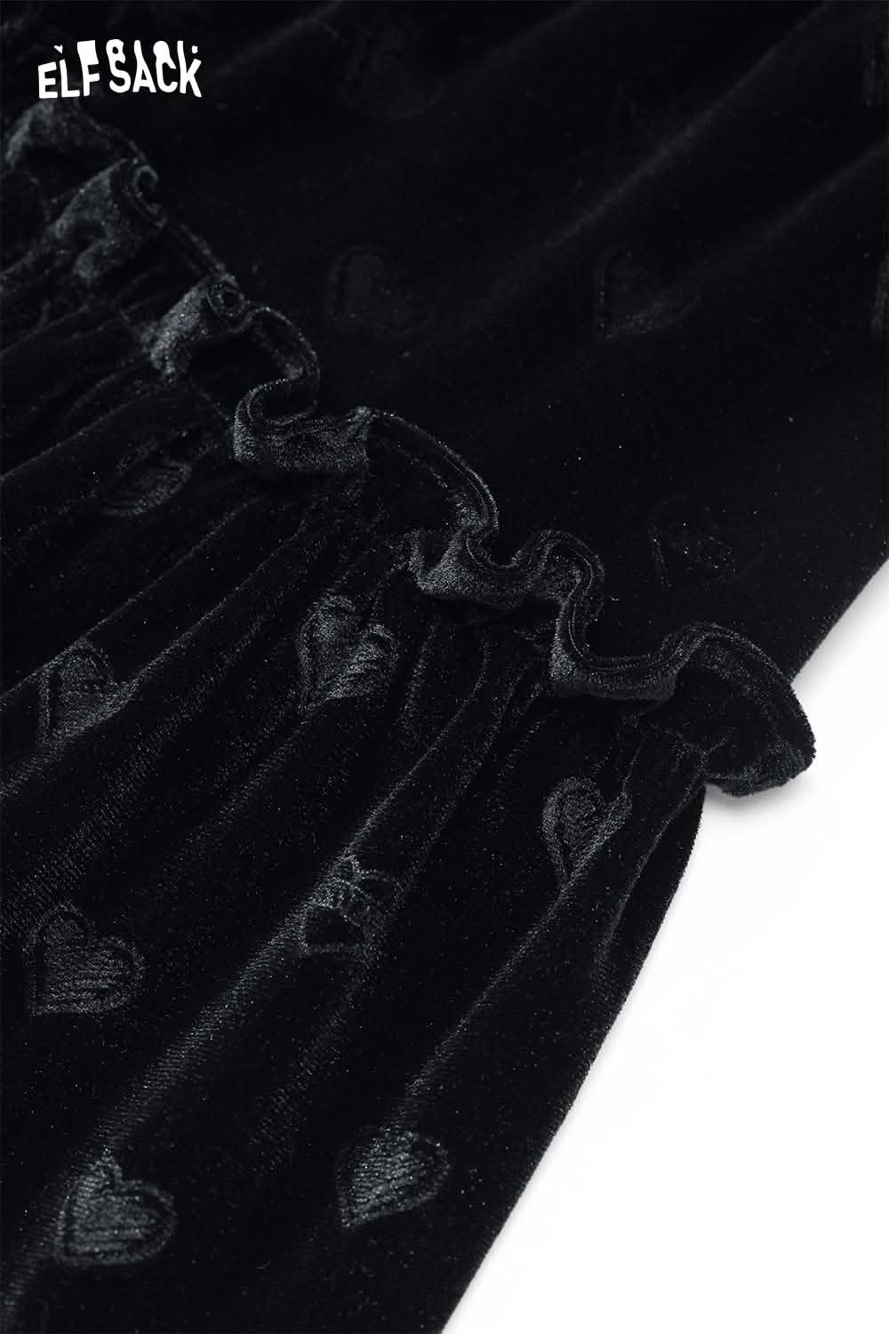 ELFSACK preppy black velvet mini skirt featuring a ruffled hem and heart texture detail