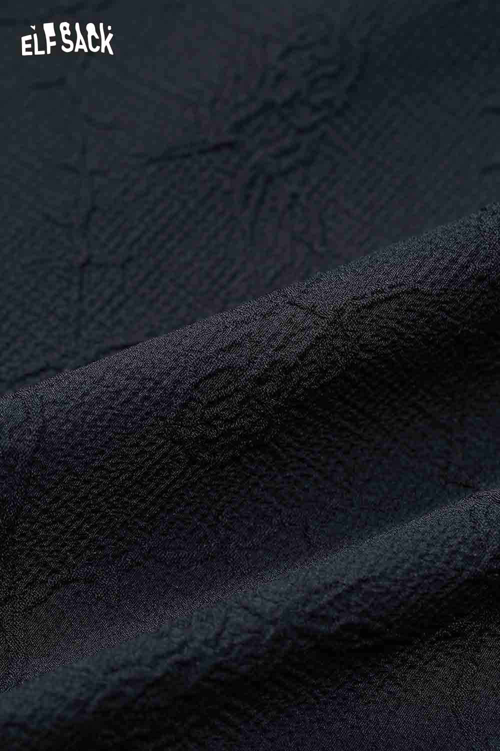 Close-up of texture on ELFSACK preppy lace collar blouse fabric in dark color