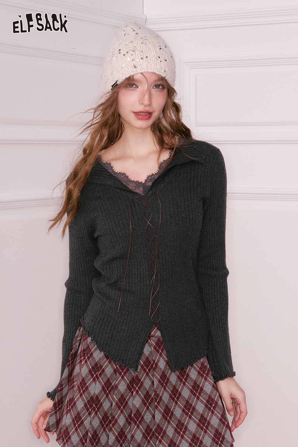 ELFSACK preppy plaid pleated short skirt paired with a cozy sweater for a stylish look