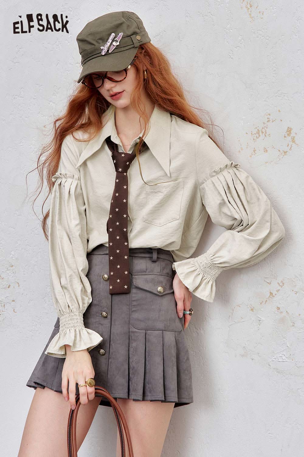 ELFSACK preppy ruffle sleeve shirt for women in light beige paired with a tie and gray pleated skirt