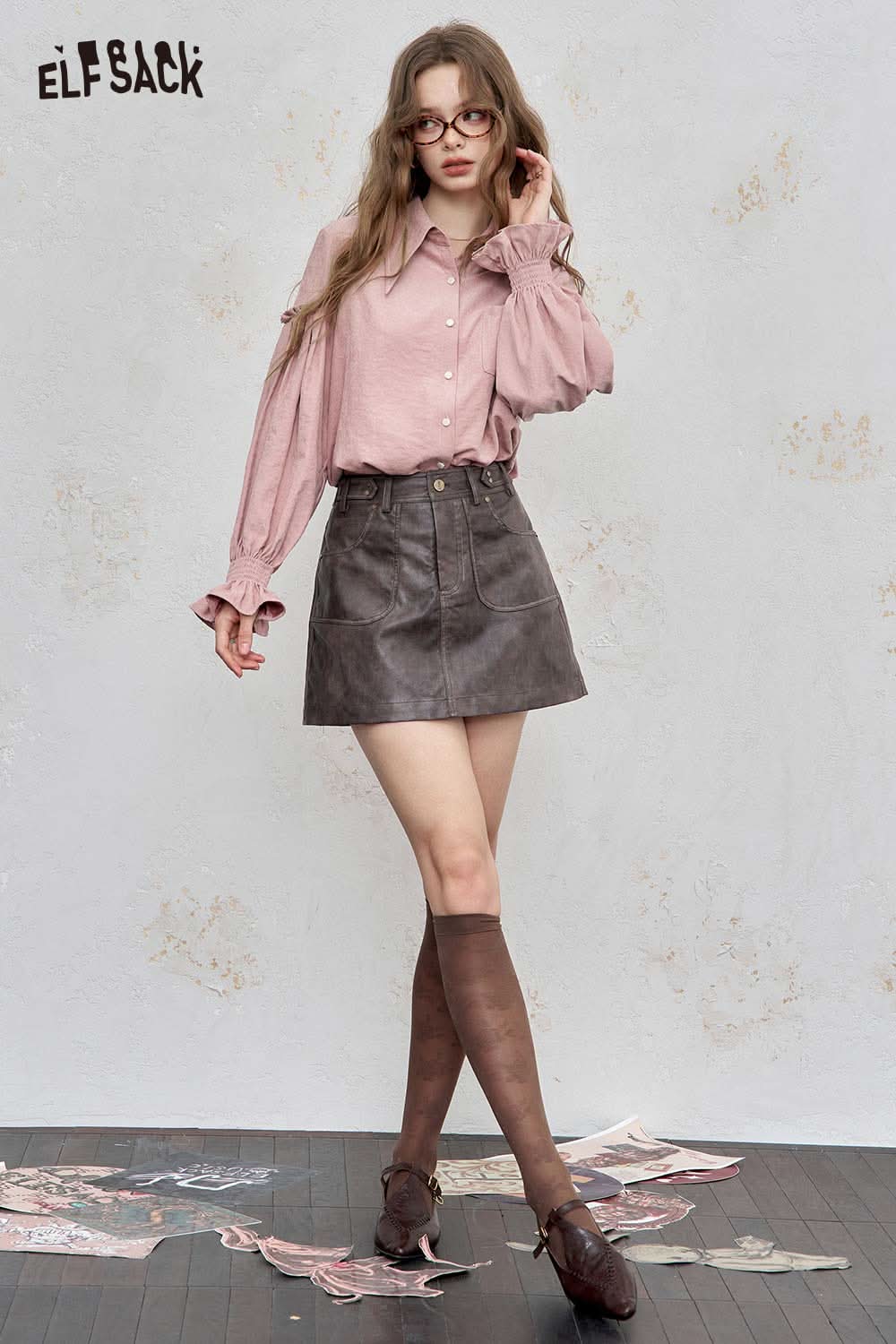ELFSACK preppy ruffle sleeve shirt for women in pink, styled with a grey skirt and knee-high stockings