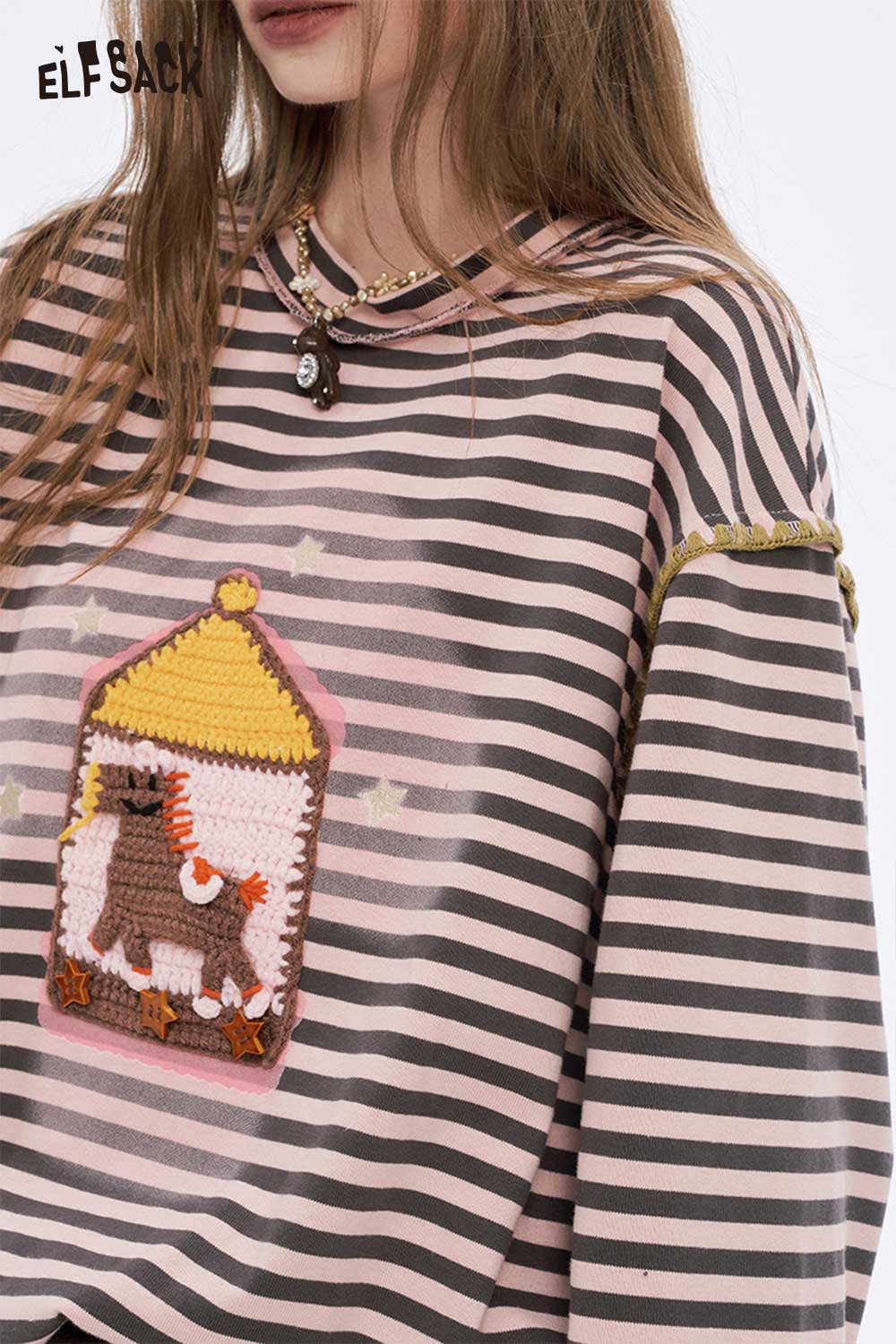 ELFSACK preppy striped graphic t-shirt for women featuring a cow design on a pink and gray striped background