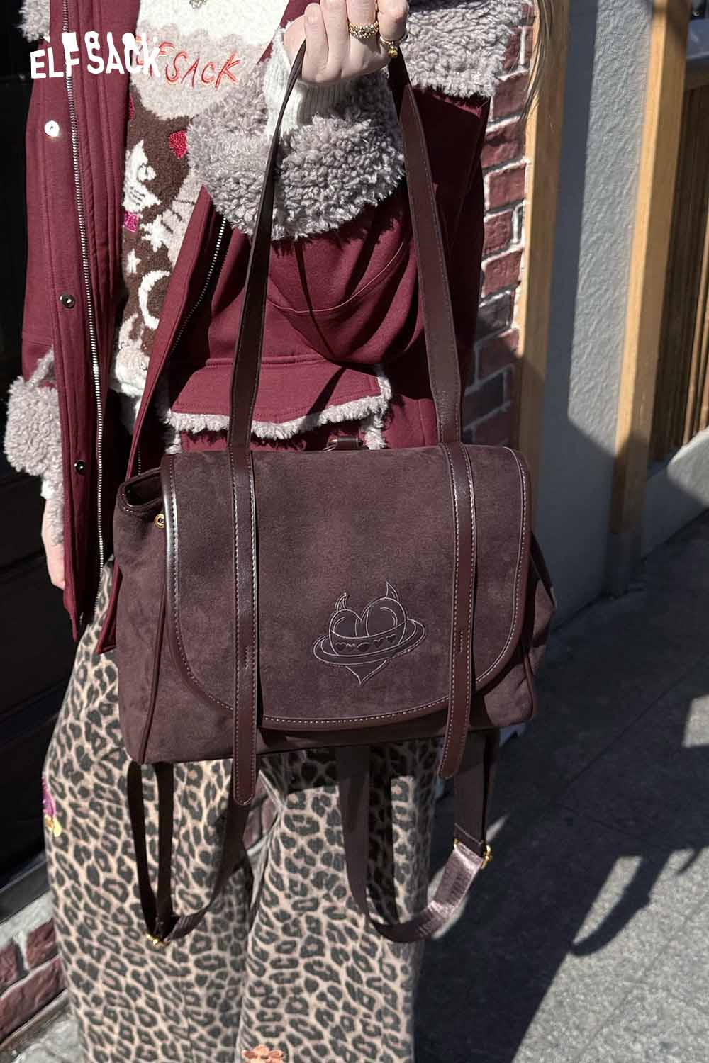 ELFSACK preppy suede backpack for women in dark brown, featuring adjustable straps and stylish design