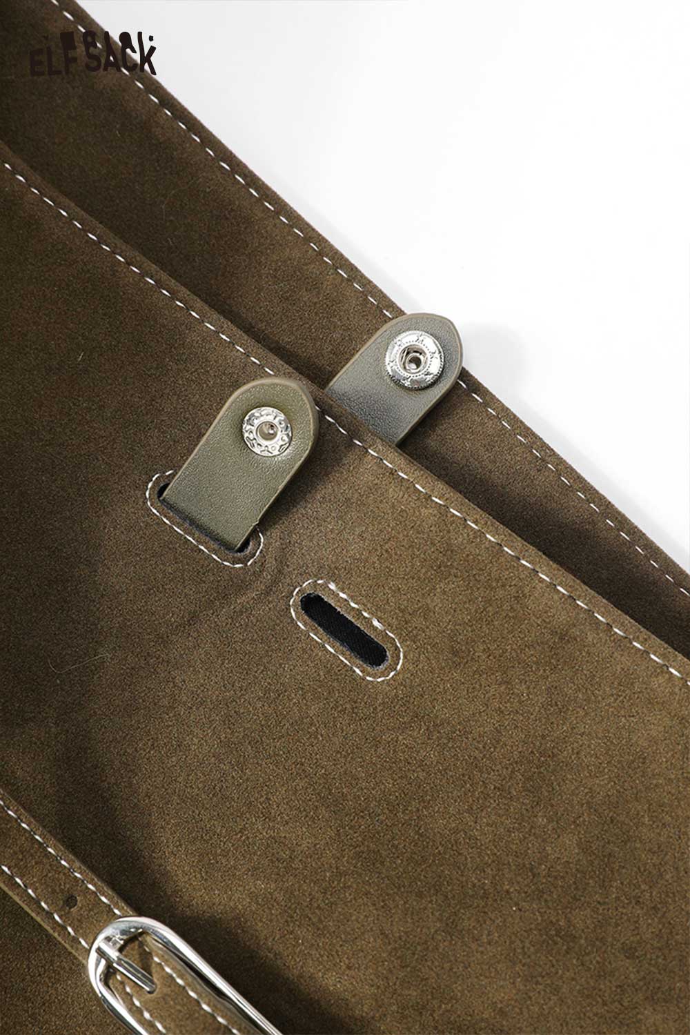 Close-up of a brown ELFSACK PU leather bucket bag for women showcasing stylish hardware details