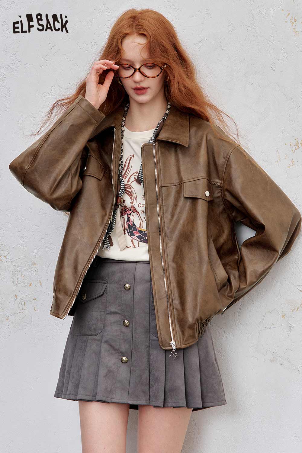 ELFSACK PU leather motocross jacket for women in brown, styled with a graphic tee and skirt