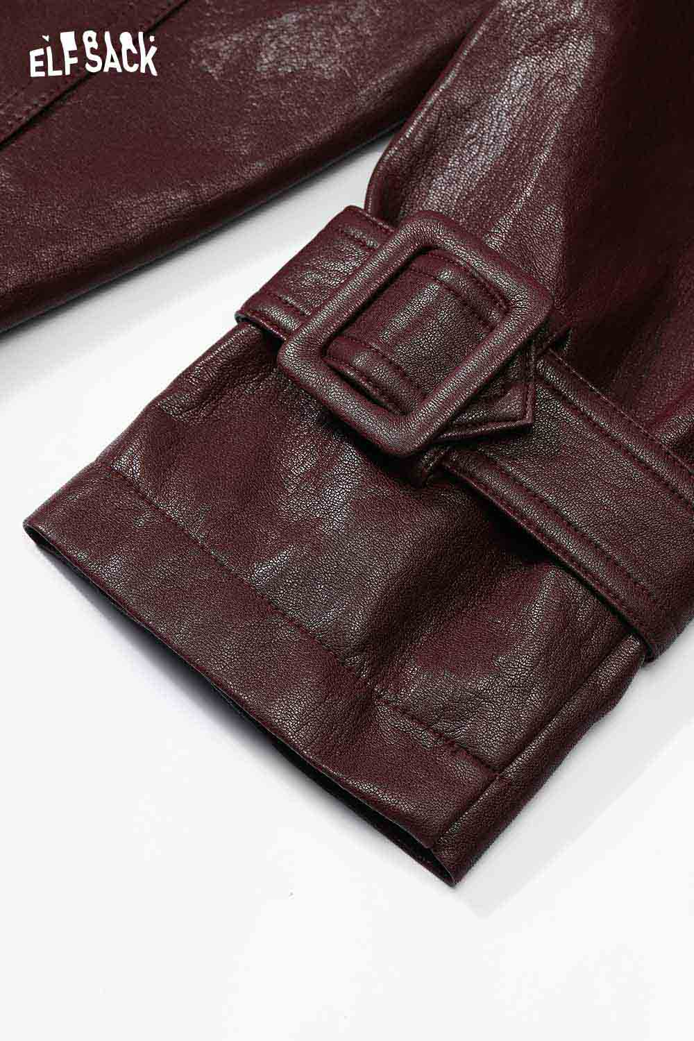 Burgundy PU leather oversized trench coat detail featuring a stylish belted cuff