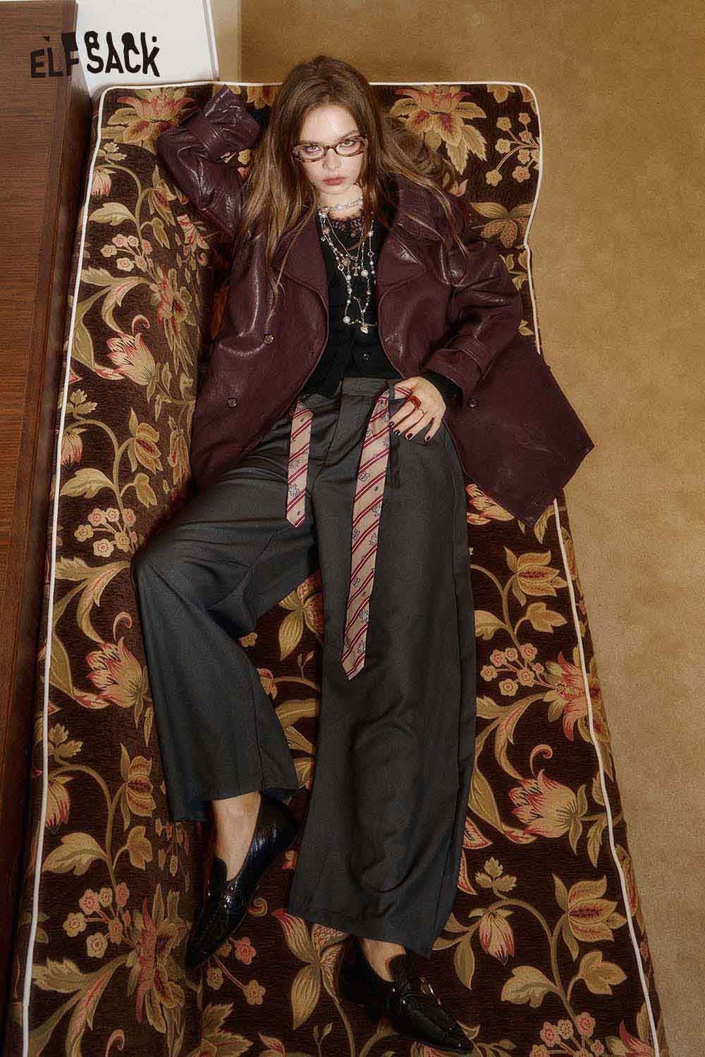Model wearing a stylish PU leather oversized trench coat with relaxed fit, paired with chic wide-leg pants