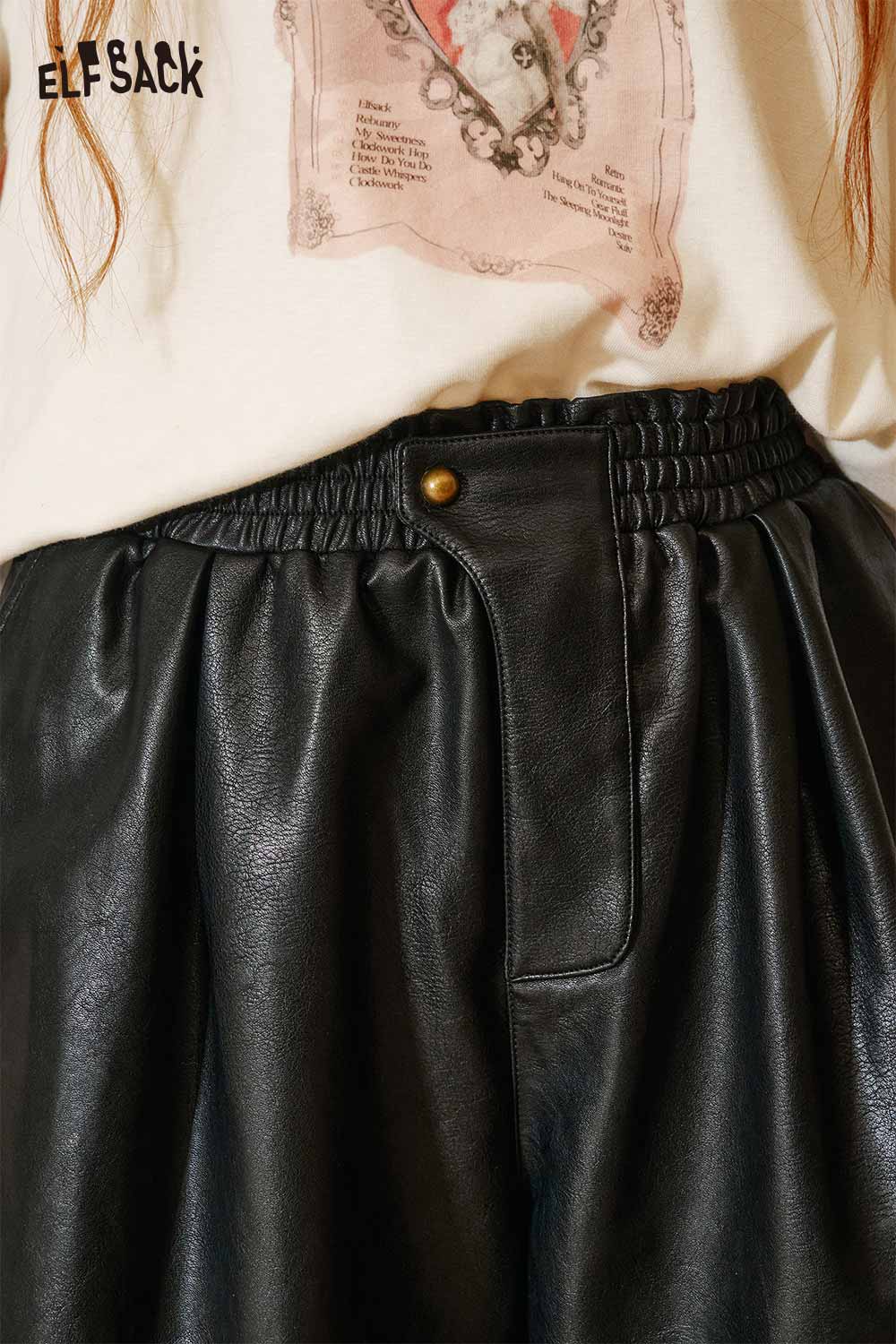 Close-up of ELFSACK PU leather pleated shorts featuring an elastic waistband and stylish design