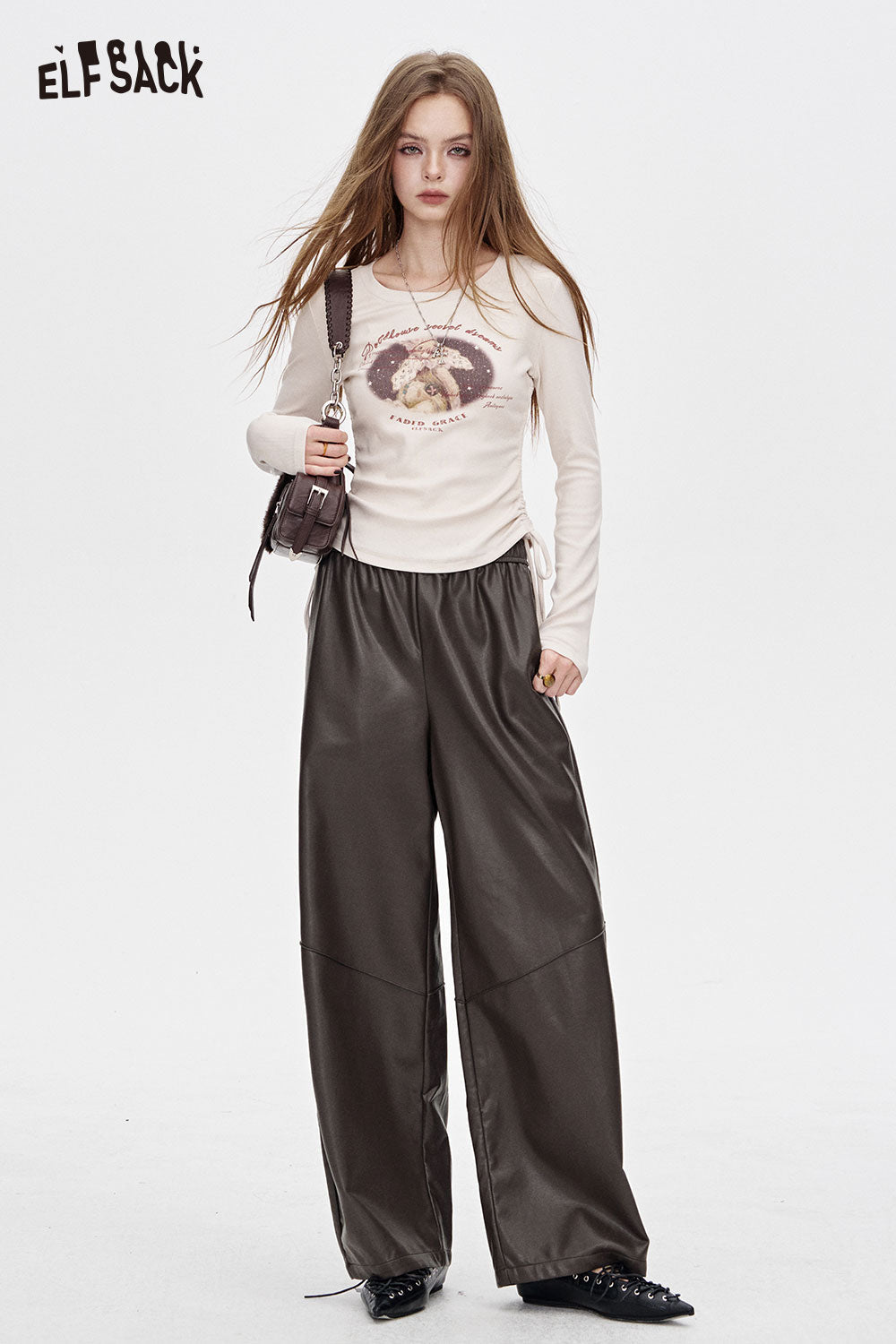 ELFSACK PU leather relaxed fit trousers styled with a light top and accessories for a trendy look