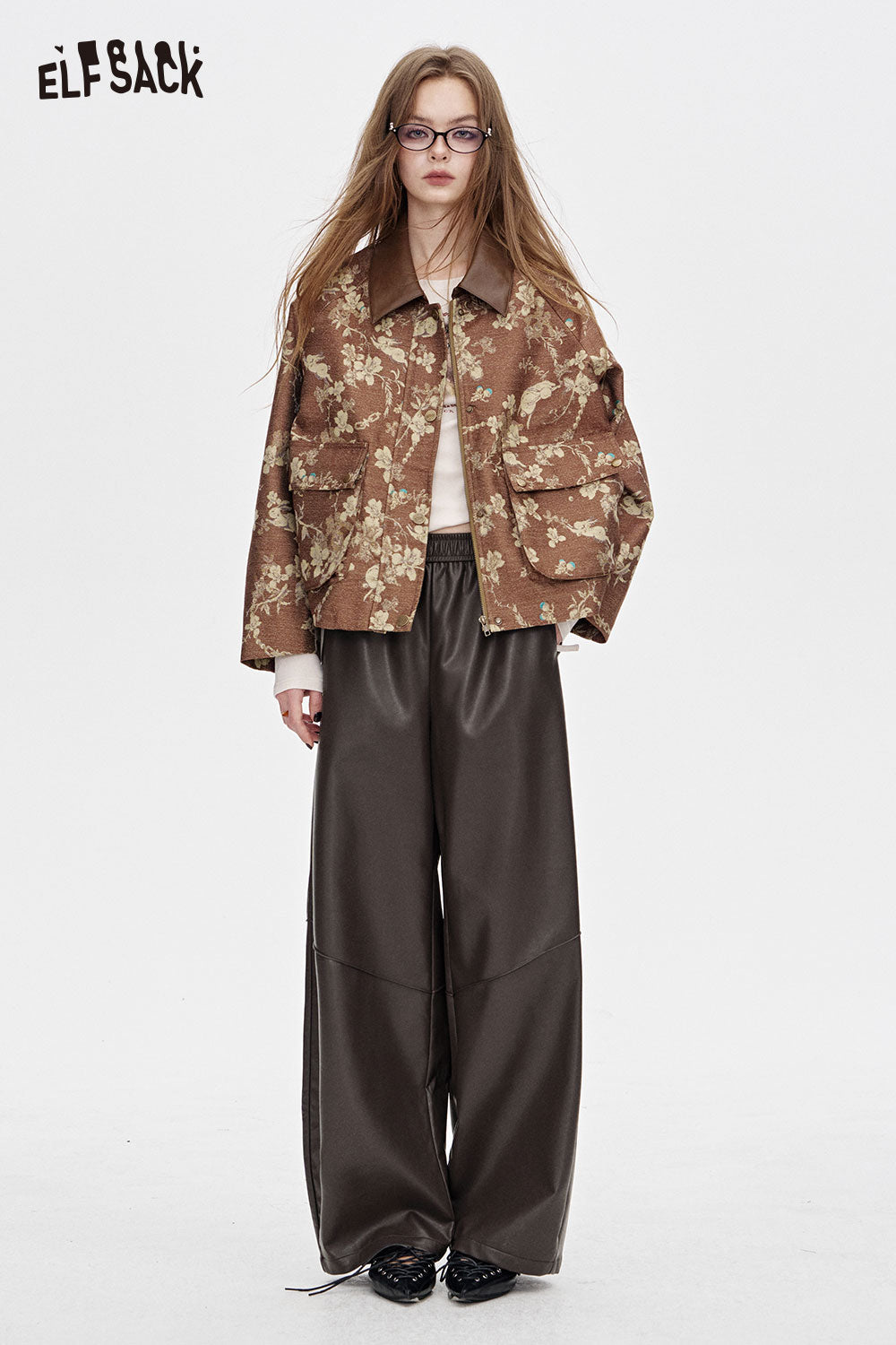 ELFSACK PU leather relaxed fit trousers in dark brown paired with a floral jacket for a stylish look
