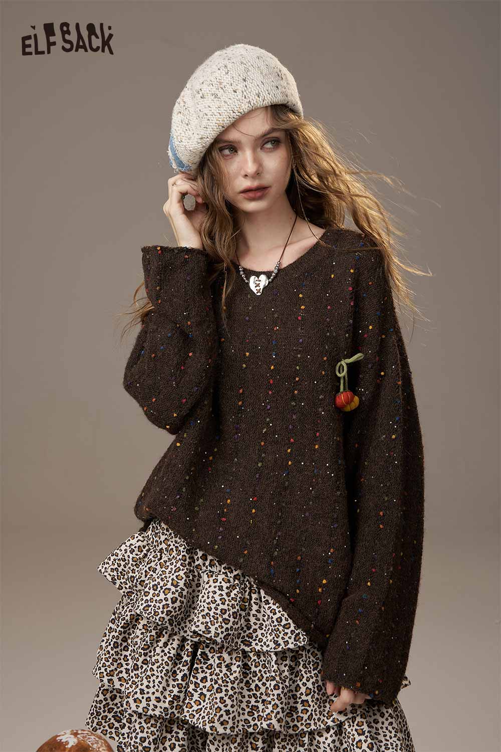 ELFSACK pumpkin motif knit sweater in brown with colorful speckles, perfect for stylish fall layering