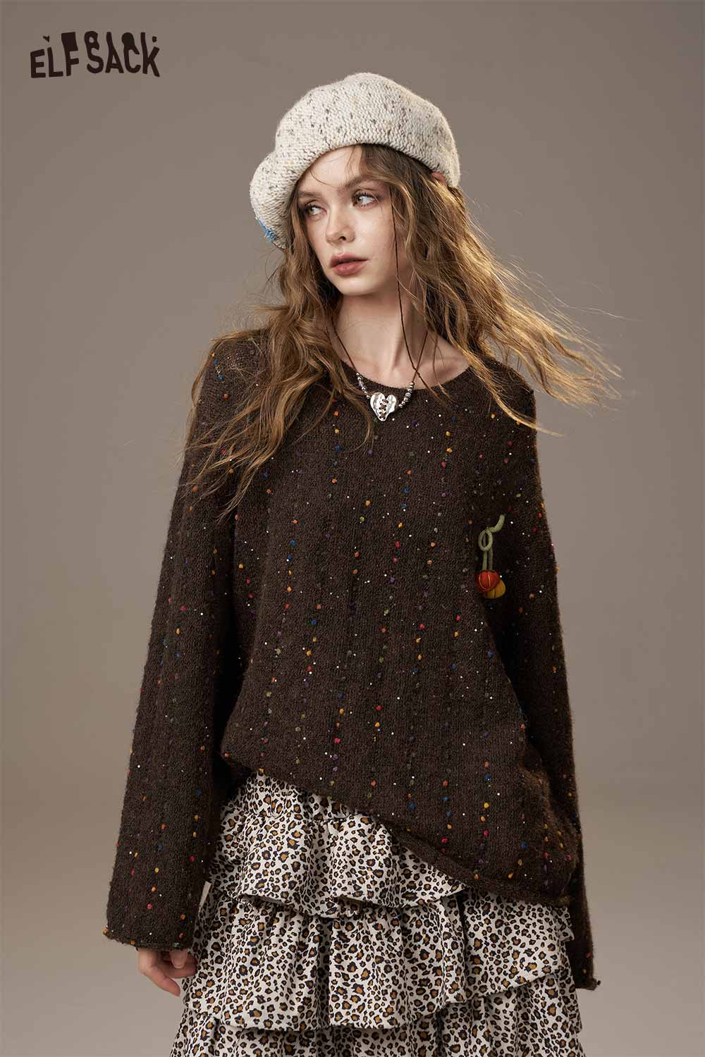 ELFSACK pumpkin motif knit sweater in brown with colorful speckles, perfect for cozy autumn styling