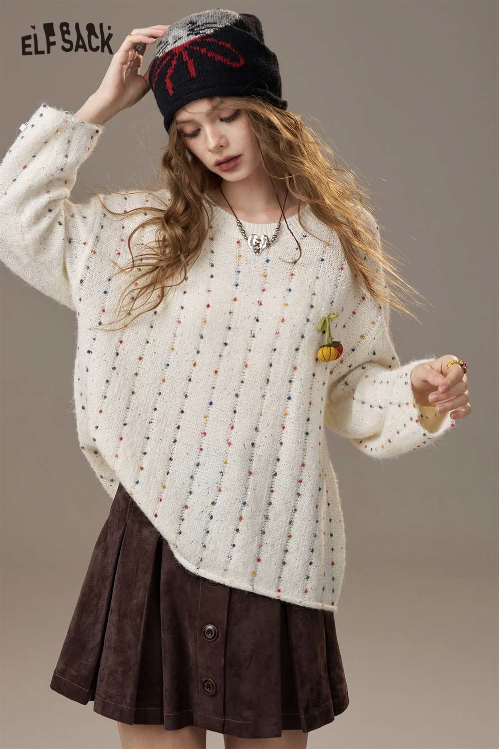 ELFSACK pumpkin motif knit sweater in cream with colorful speckles and a cute pumpkin detail