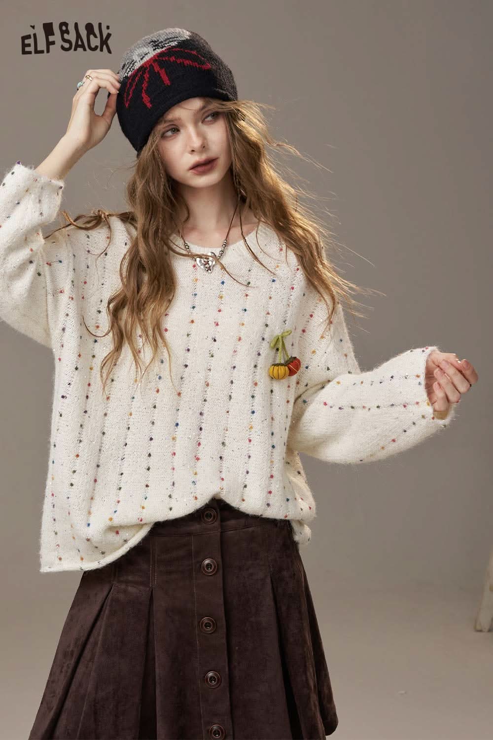 Cozy ELFSACK pumpkin motif knit sweater with colorful dots and a cute pumpkin design