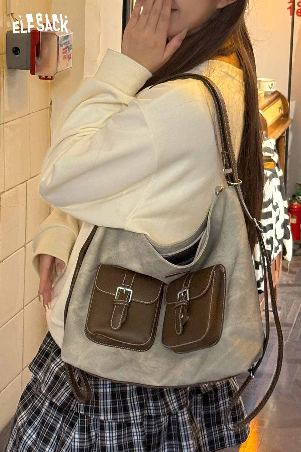 ELFSACK recycled faux leather crossbody bag with dual front pockets and adjustable strap