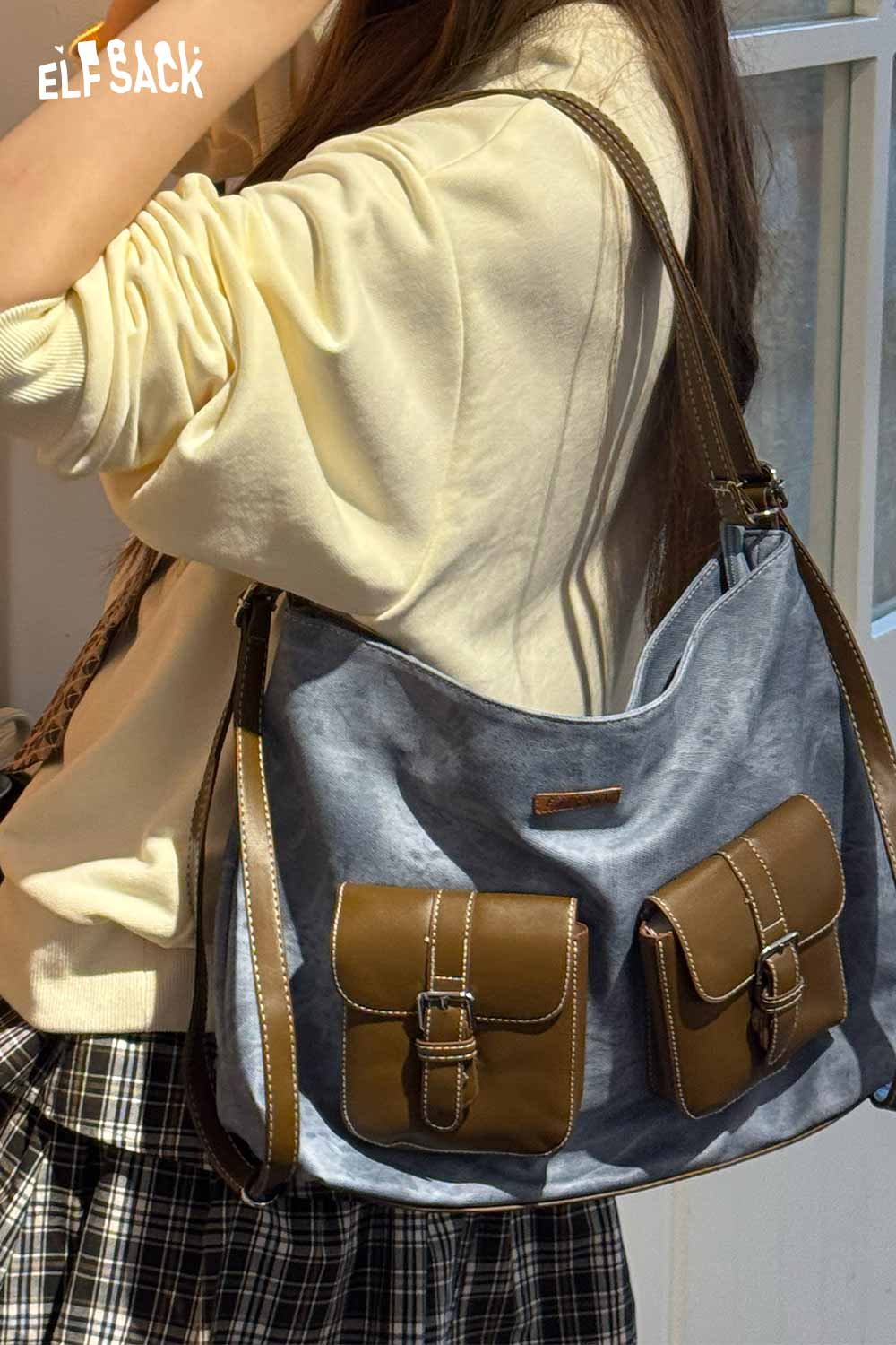 ELFSACK recycled faux leather crossbody bag featuring dual front pockets and adjustable strap