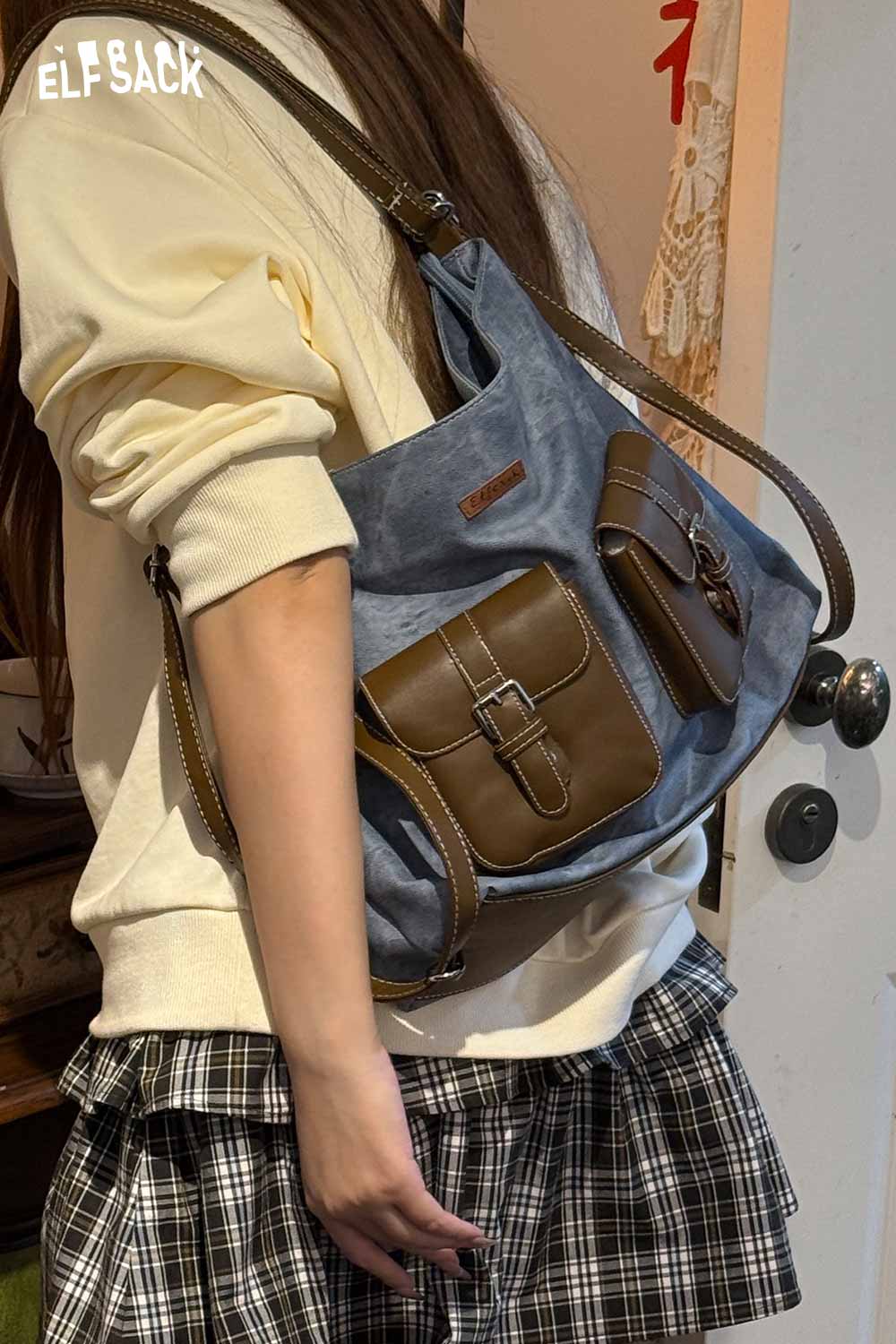 ELFSACK recycled faux leather crossbody bag in blue with stylish pockets for everyday use