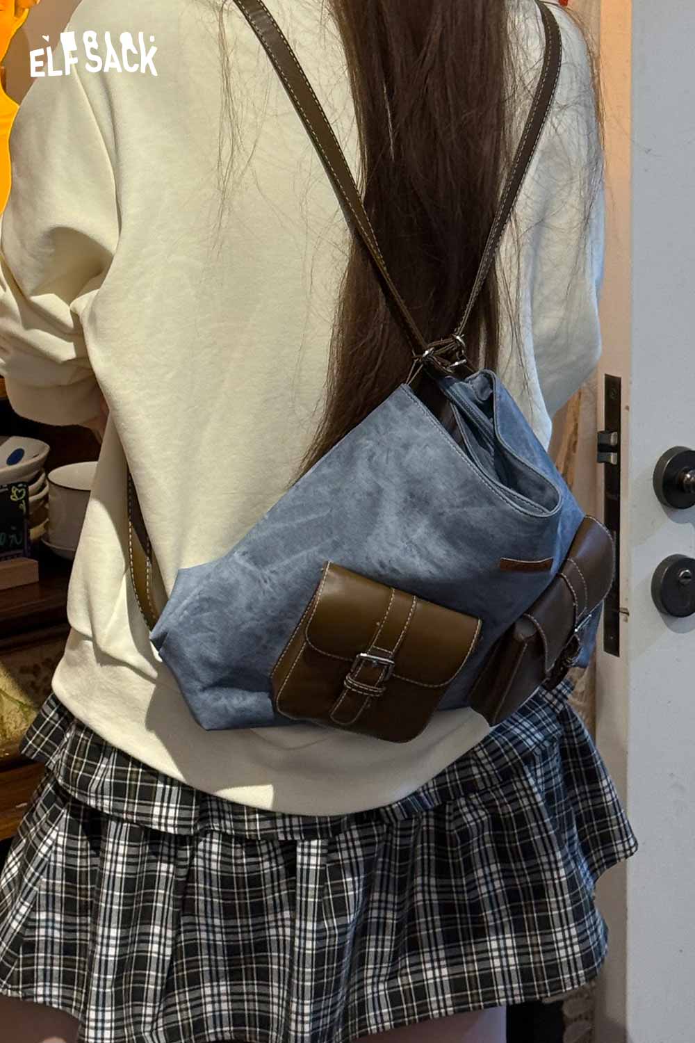 ELFSACK recycled faux leather crossbody bag in blue with stylish pocket detail for everyday use