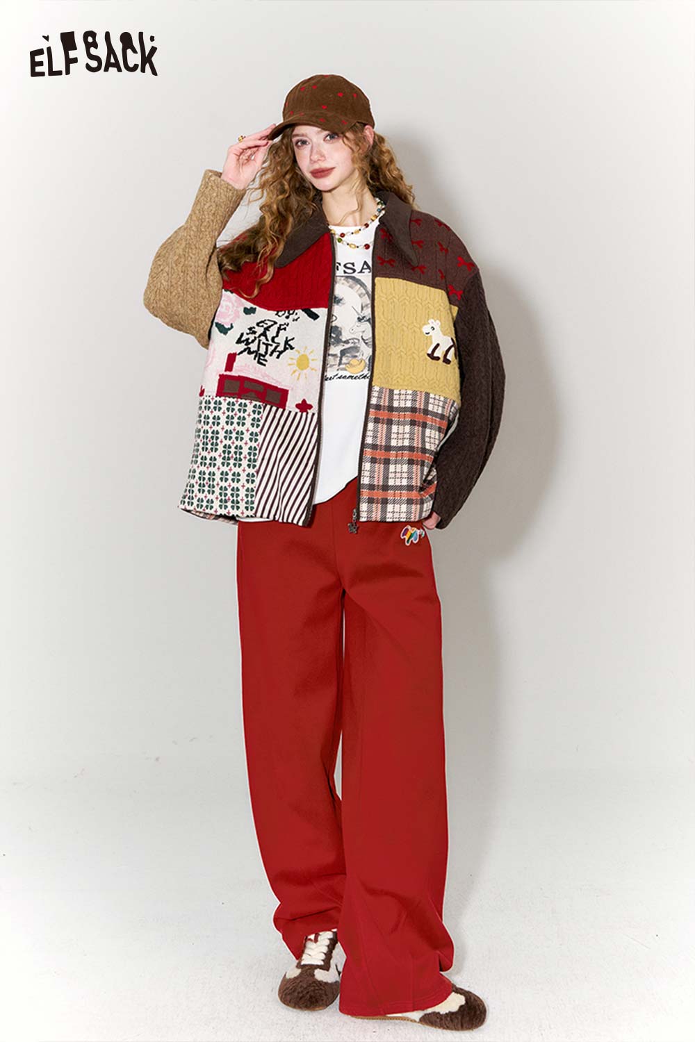 Fashion model wearing red wide leg pants for women with a colorful oversized jacket