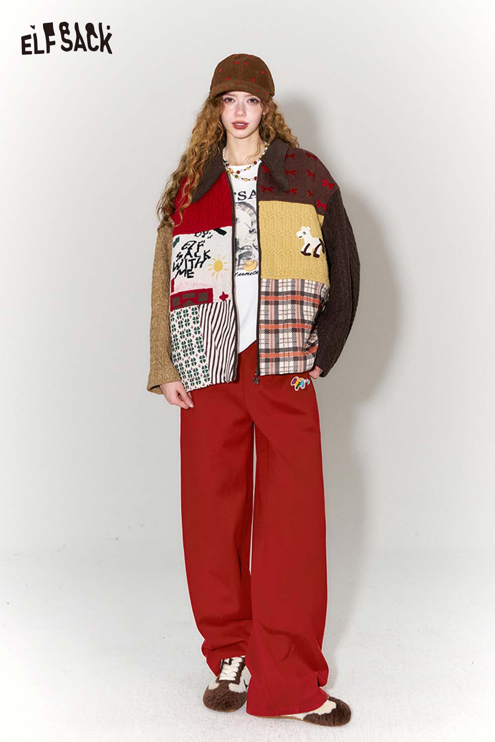 Stylish model wearing red wide leg pants for women paired with a patchwork jacket