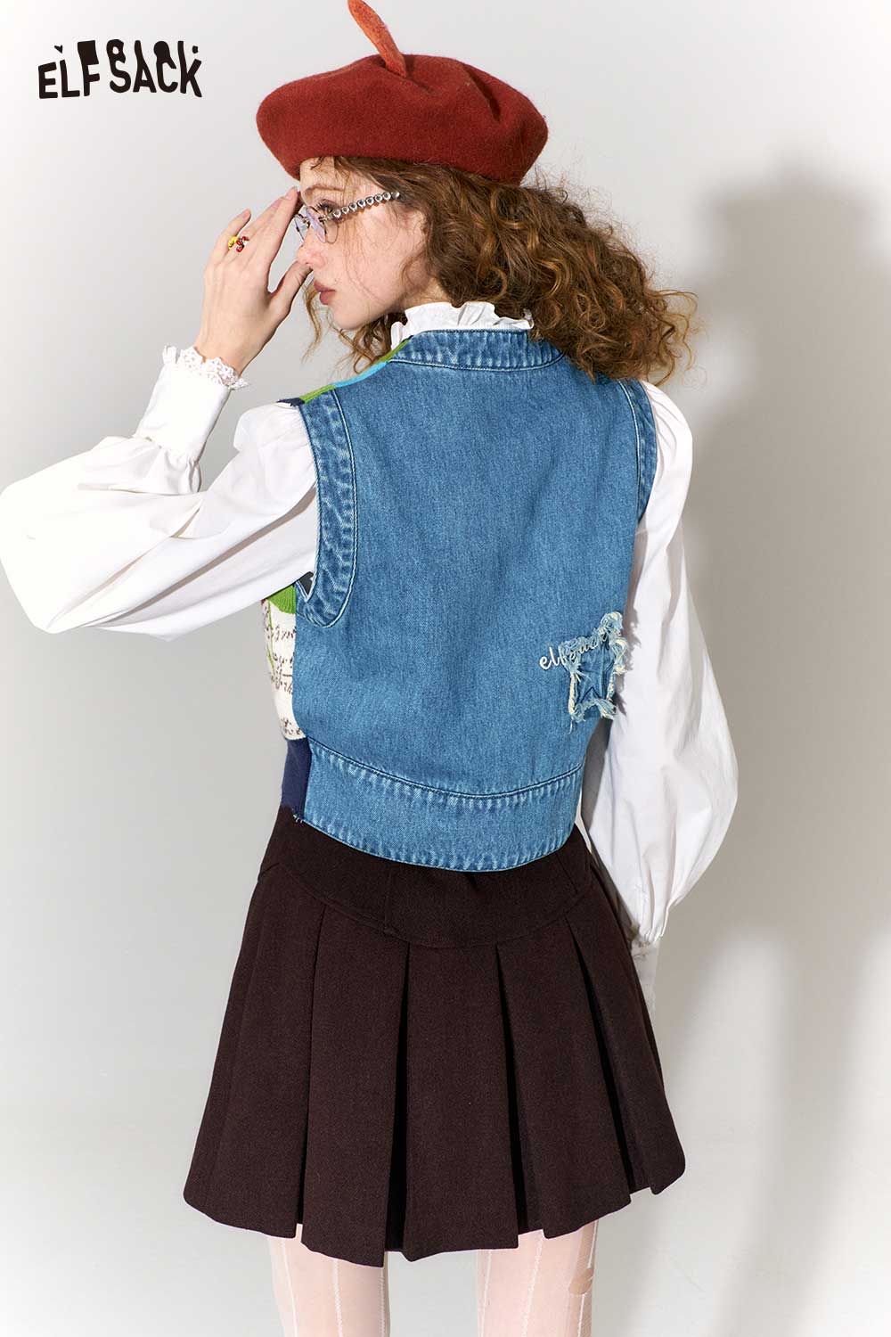 ELFSACK retro denim knit vest for women styled with a white blouse and a brown skirt