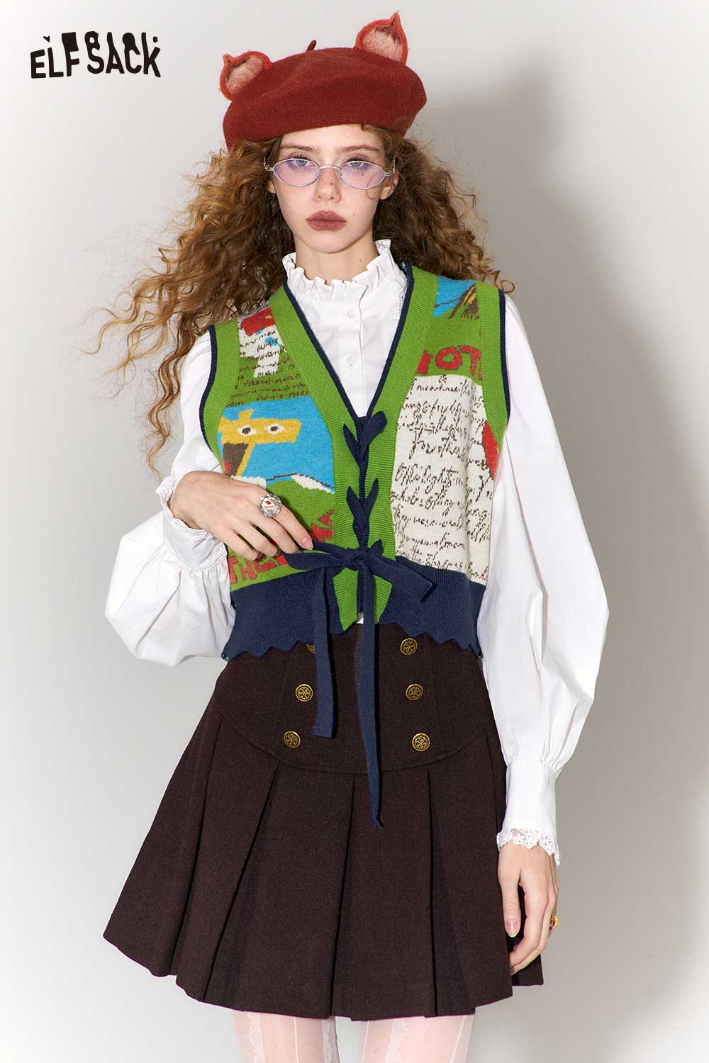 ELFSACK retro denim knit vest for women featuring colorful patterns and a stylish bow tie