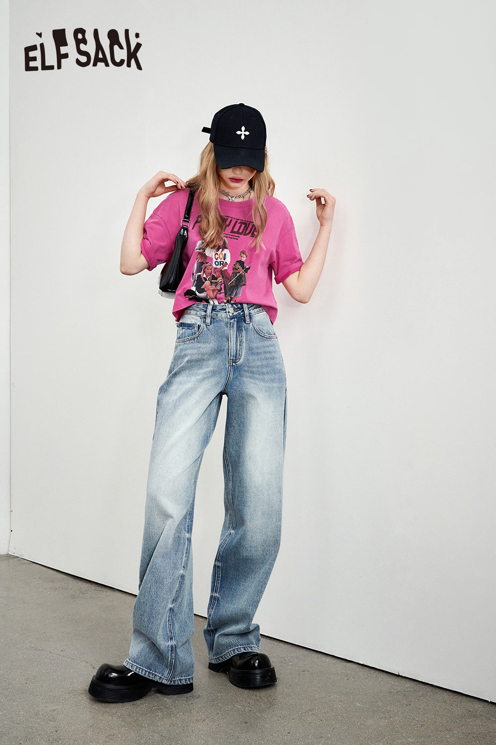 ELFSACK Retro Graphic pink T-shirt paired with wide-leg blue jeans and black shoes