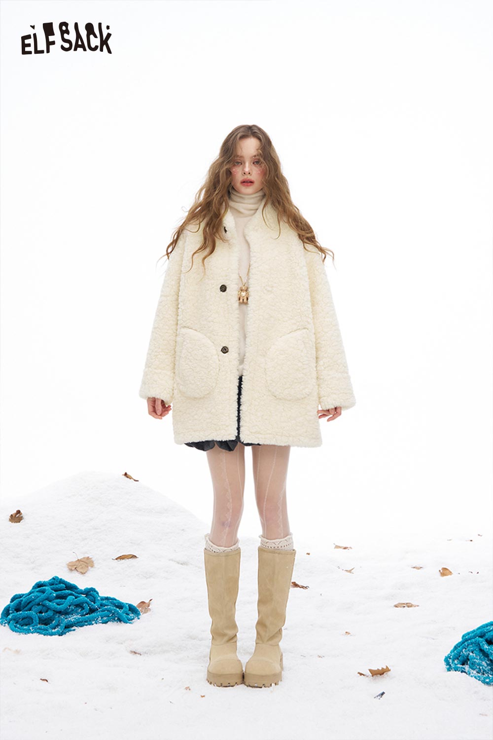 ELFSACK reversible plush long coat in cream with large pockets, perfect for winter fashion.