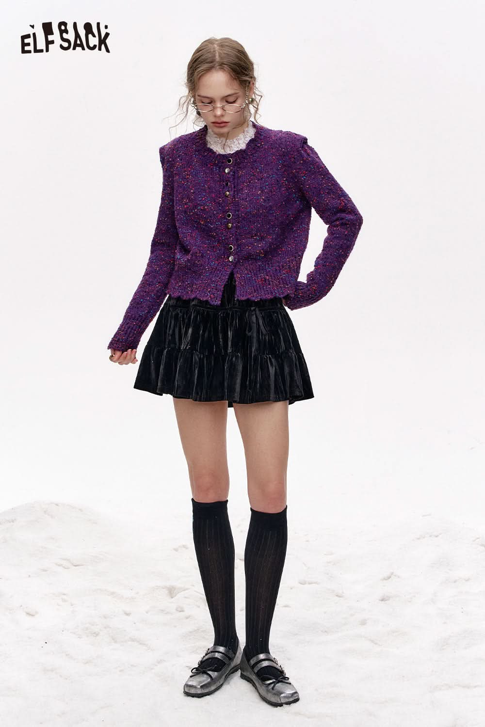 ELFSACK ruched mini skirt for women styled with a colorful cardigan and knee-high socks