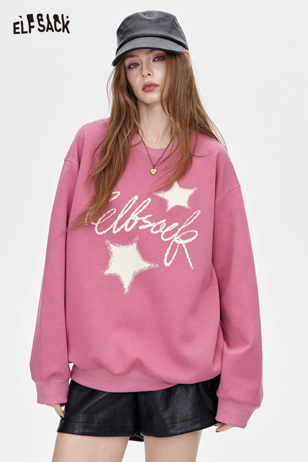 Pink oversized graphic star sweatshirt by ELFSACK with unique star design for trendy casual wear