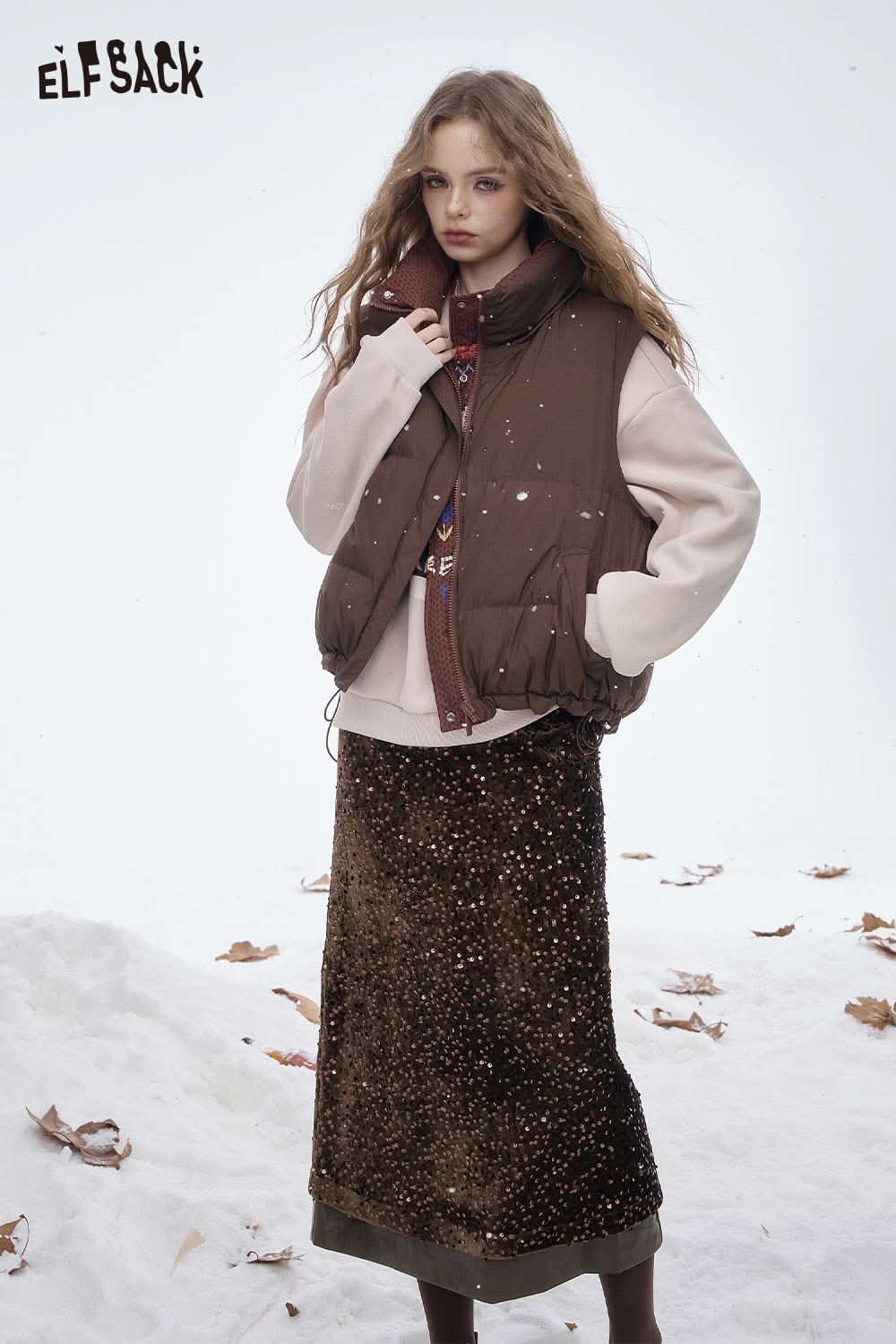 ELFSACK sequin faux leather long skirt styled with a cozy oversized vest and layered sweater
