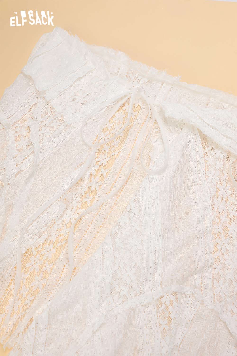 ELFSACK sheer lace overlay skirt with delicate detailing and soft fabric for a stylish summer look