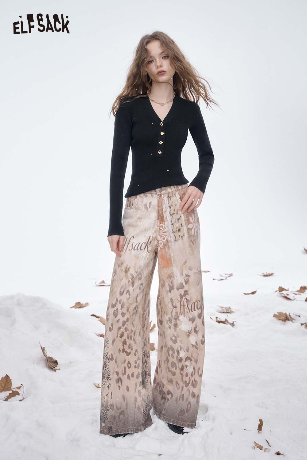ELFSACK slim fit V neck knit sweater paired with stylish printed wide-leg pants for a trendy look