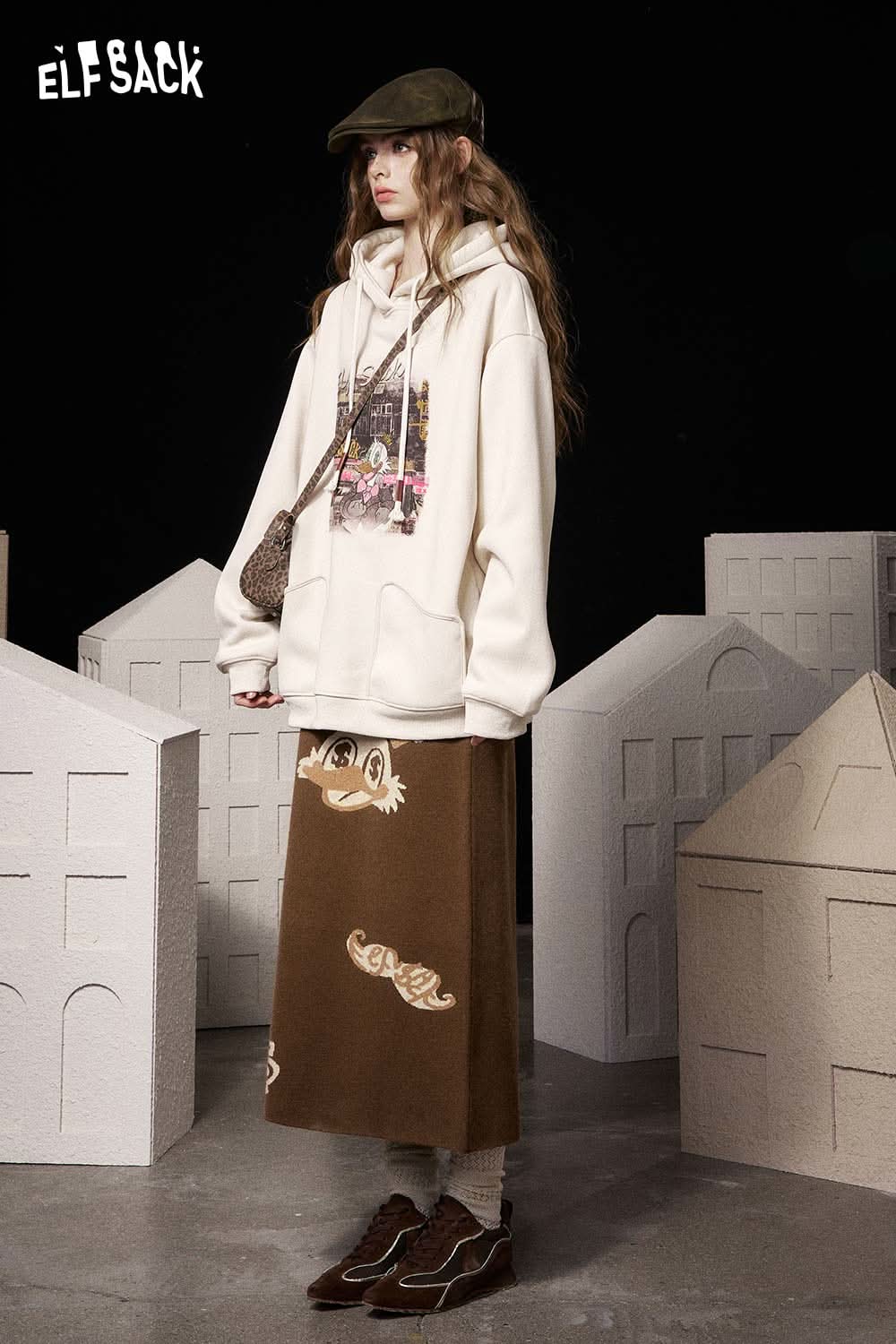 ELFSACK soft animal graphic long skirt in brown paired with a cozy hoodie for a trendy look