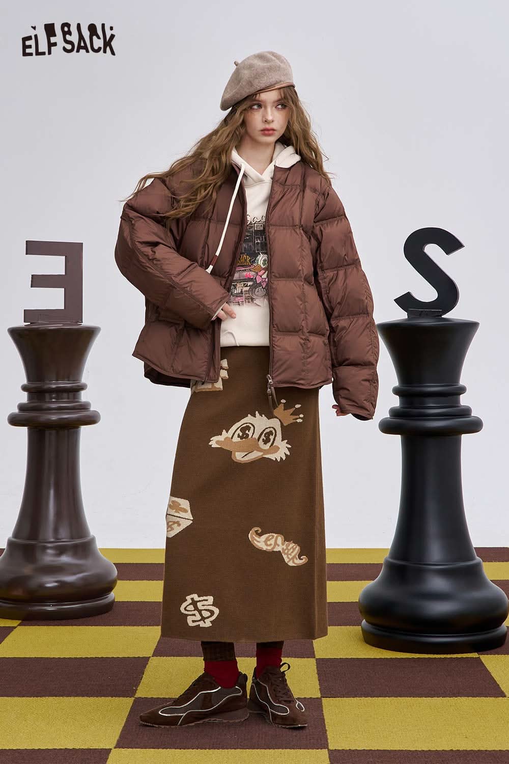 ELFSACK soft animal graphic long skirt in brown with playful animal prints, styled with a cozy puffer jacket