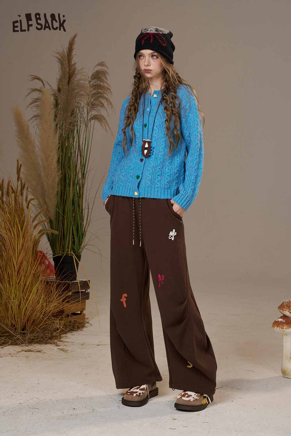 Bright blue ELFSACK soft knit cardigan for women featuring a cozy design and stylish buttons